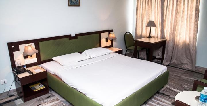 asic AC room at Ganesha Sadan Srisailam with comfortable bed and clean interiors